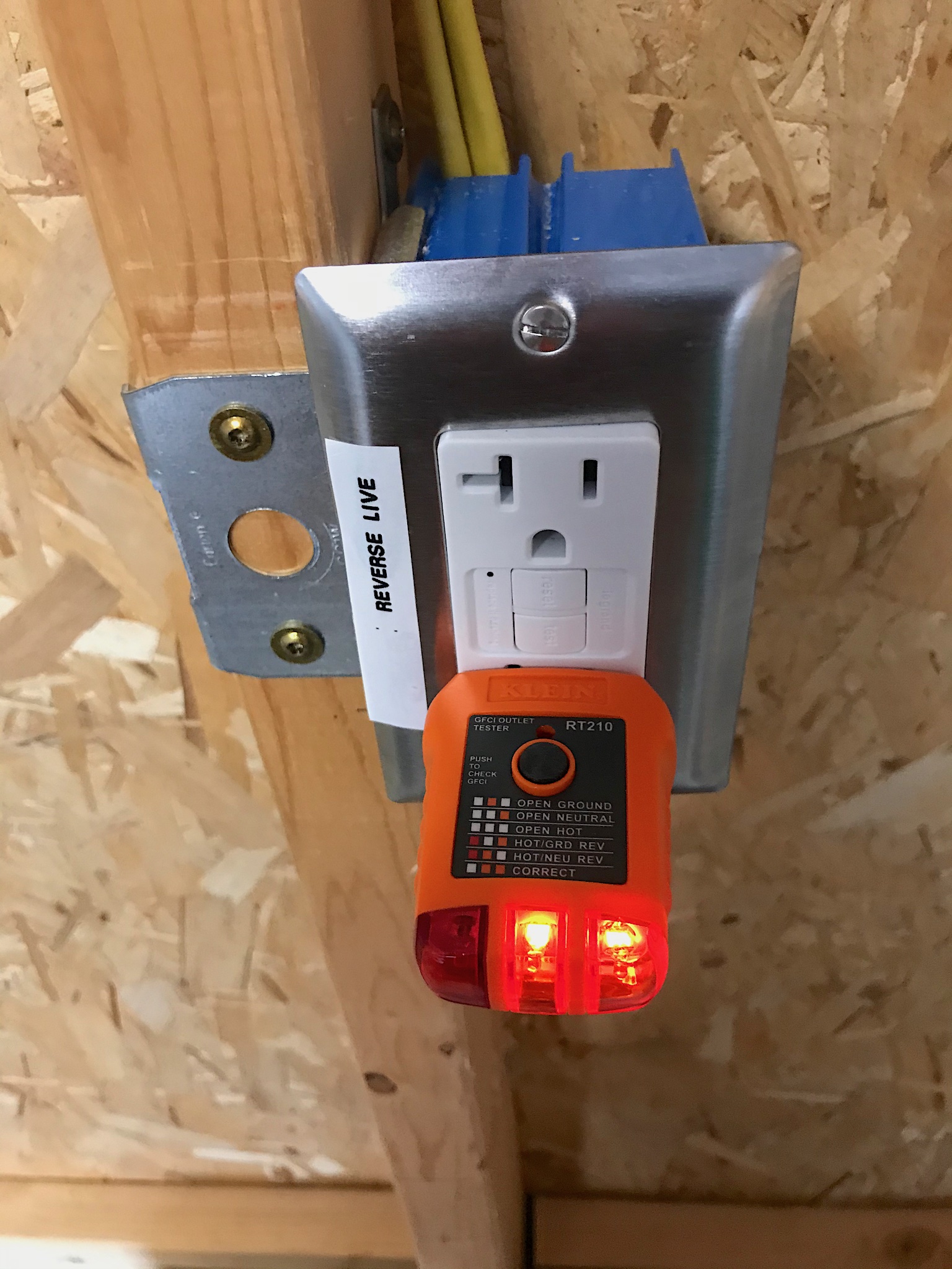 An outlet being tested after it was identified as having the live and neutral swapped